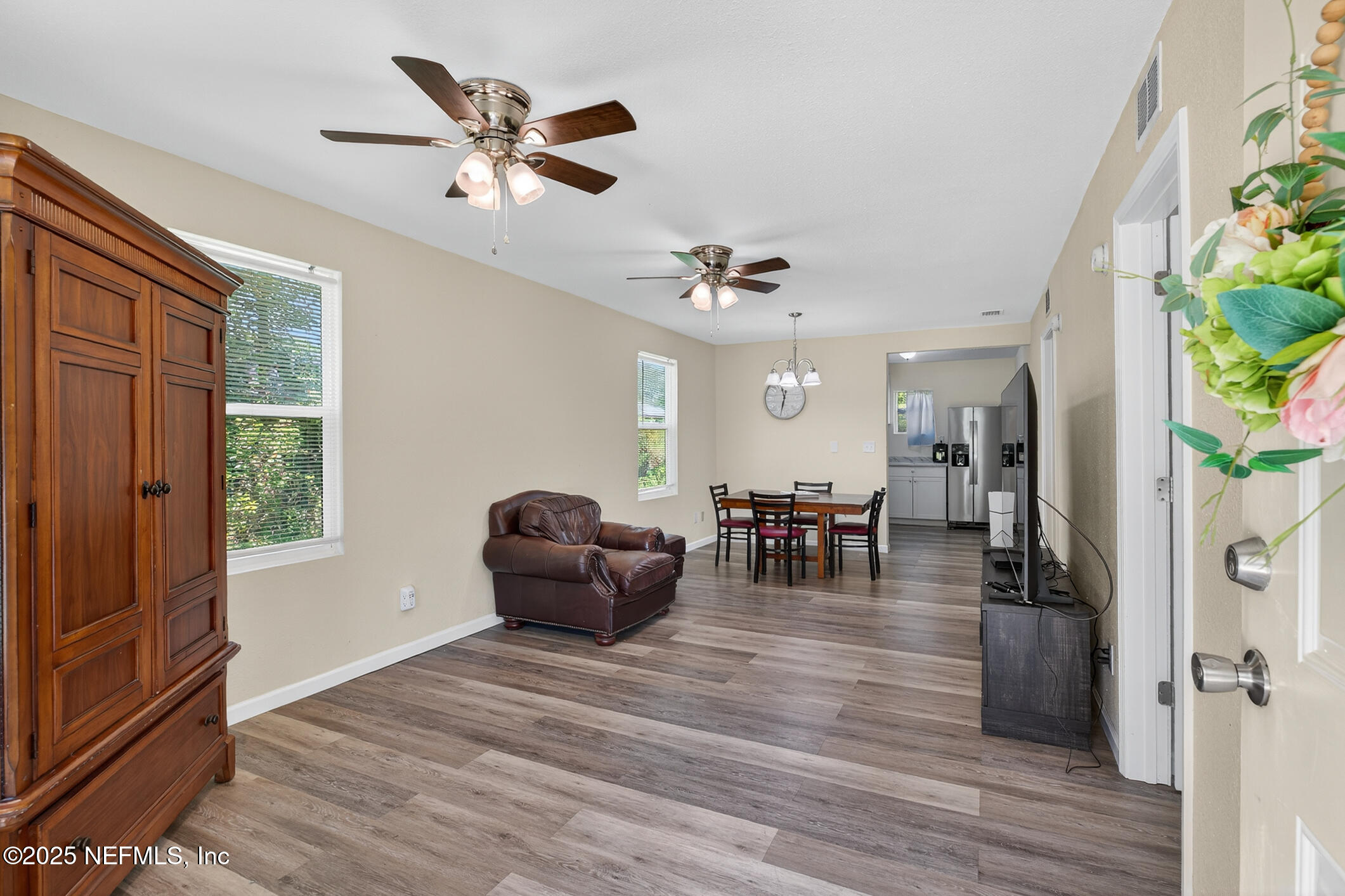 631 Moore Street Baldwin, FL 32234 - Photo 8 of 36 a living room with furniture and a wooden floor