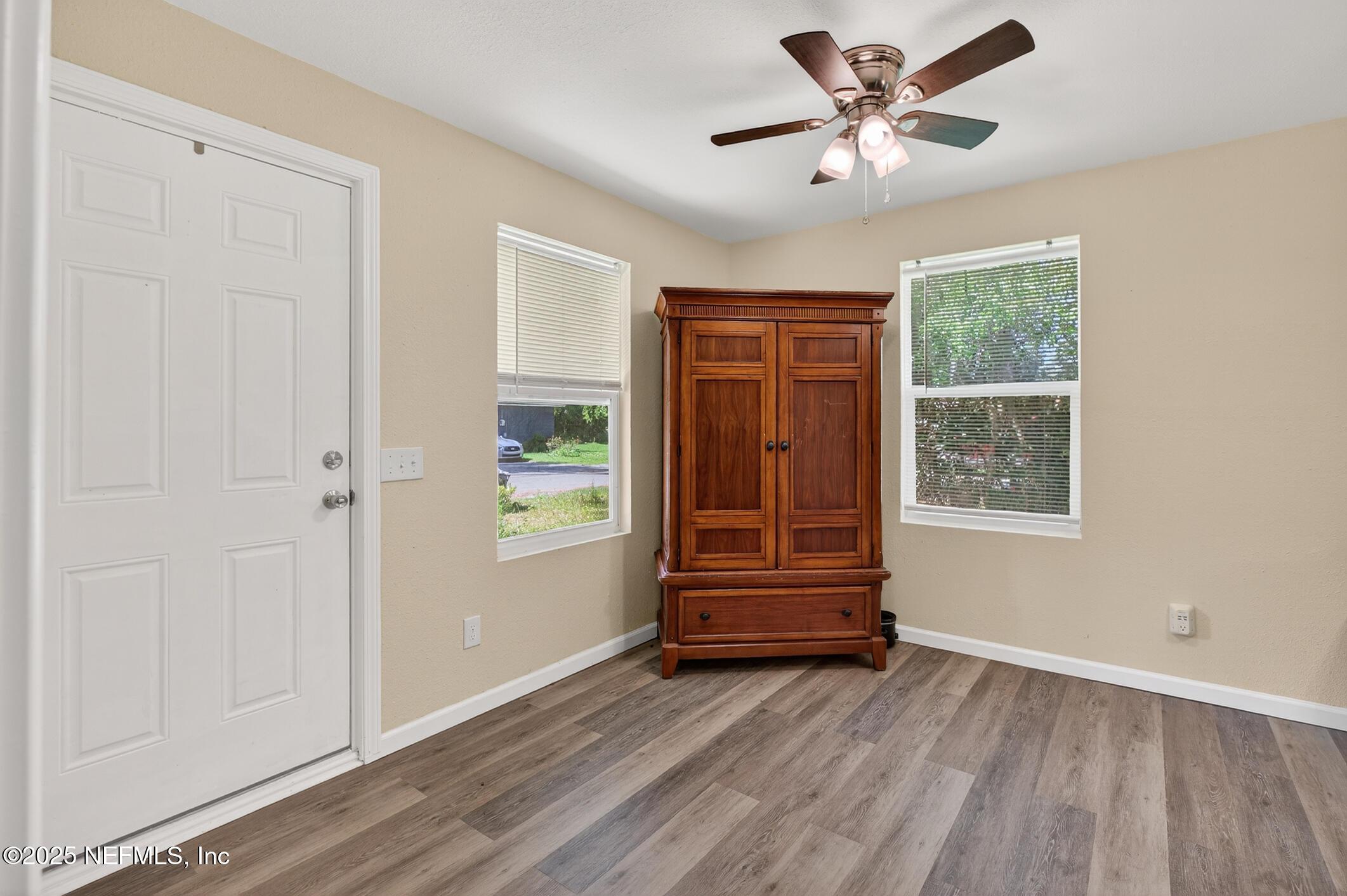 631 Moore Street Baldwin, FL 32234 - Photo 9 of 36 a view of room with window ceiling fan and hardwood floor