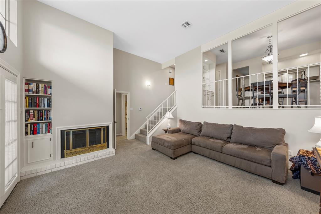 2901 Lake Shore Drive, Unit 405 Waco, TX 76708 - Photo 4 of 31 a living room with furniture and a fireplace