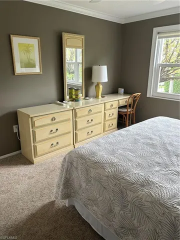 a bed room with a bed and a window