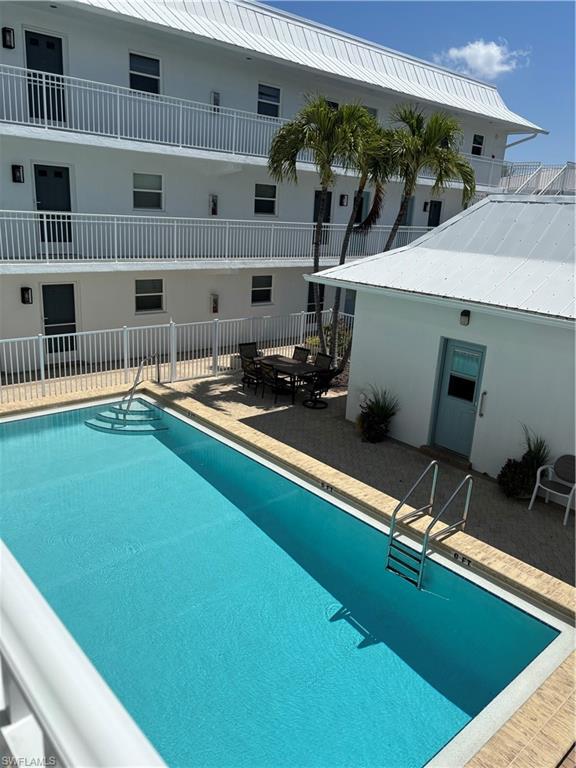 1021 3rd Street South, Unit 200 Naples, FL 34102 - Photo 2 of 26 a view of a room with shelves