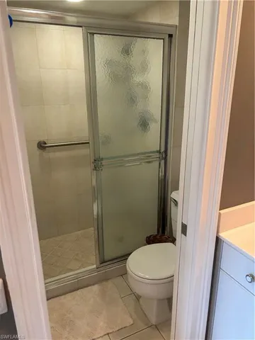 a bathroom with a shower and a toilet