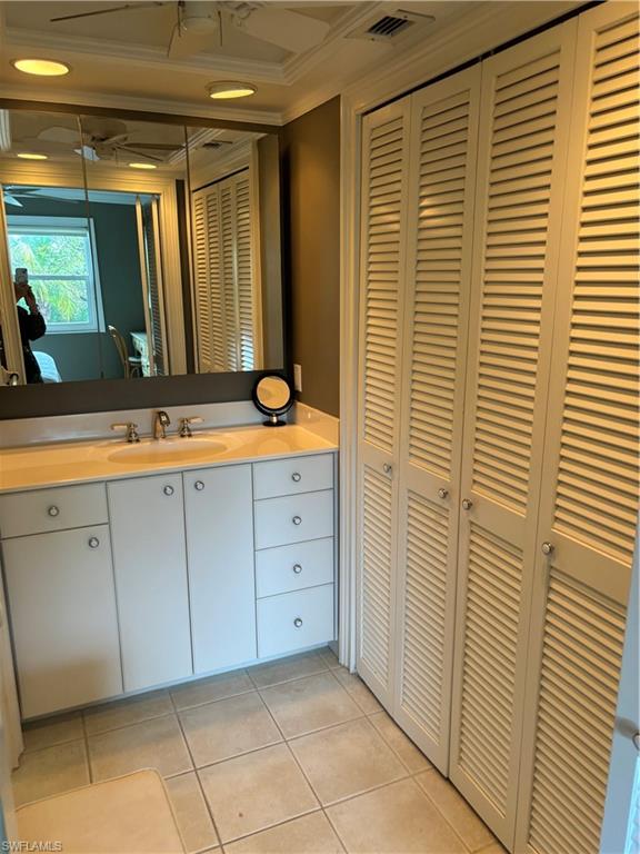 1021 3rd Street South, Unit 200 Naples, FL 34102 - Photo 22 of 26 a bathroom with a granite countertop sink and a mirror
