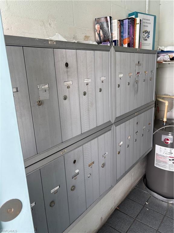 1021 3rd Street South, Unit 200 Naples, FL 34102 - Photo 26 of 26 a kitchen with cabinets and window