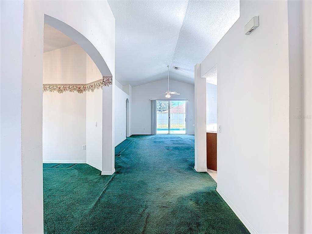 4824 Woodmere Road Land O Lakes, FL 34639 - Photo 14 of 50 a view of a big room with closet and windows