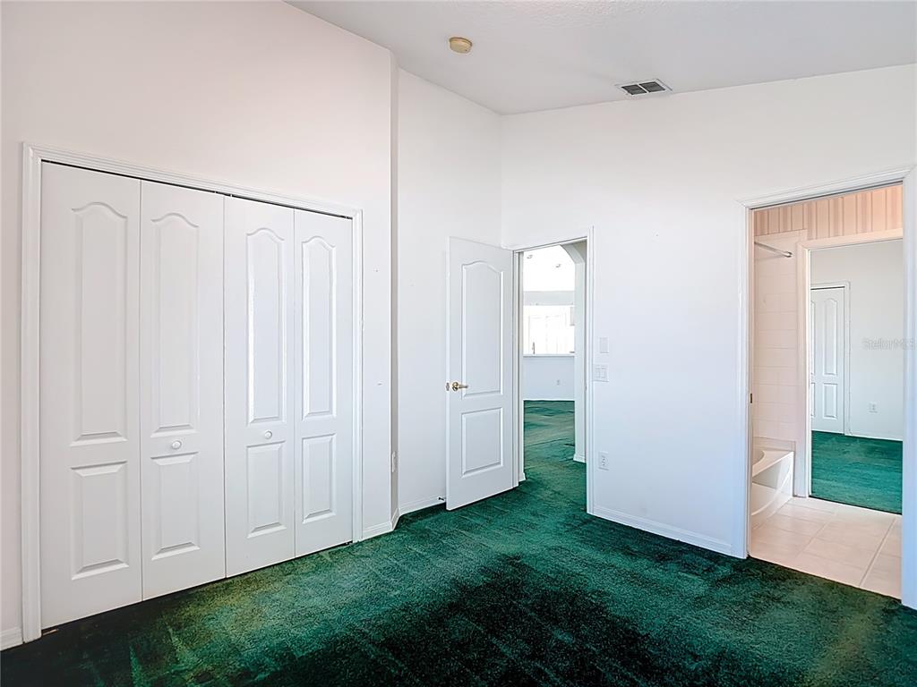 4824 Woodmere Road Land O Lakes, FL 34639 - Photo 28 of 50 a view of a closet in a room