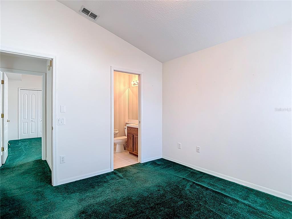 4824 Woodmere Road Land O Lakes, FL 34639 - Photo 30 of 50 a view of an empty room with closet