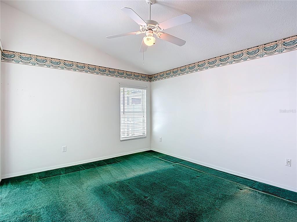 4824 Woodmere Road Land O Lakes, FL 34639 - Photo 32 of 50 a view of an empty room and a window