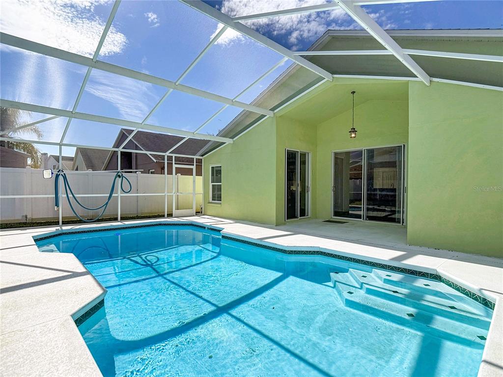 4824 Woodmere Road Land O Lakes, FL 34639 - Photo 36 of 50 a view of a backyard of a house