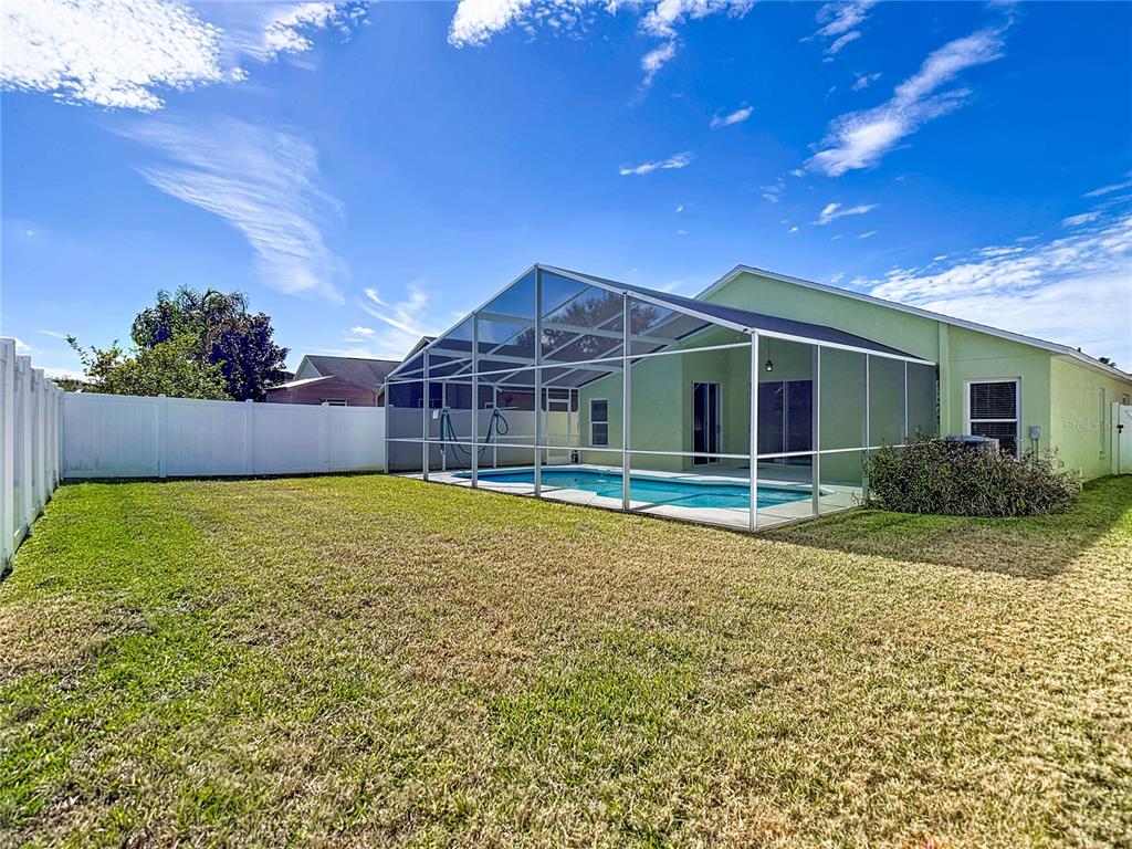4824 Woodmere Road Land O Lakes, FL 34639 - Photo 40 of 50 a view of pool with a backyard