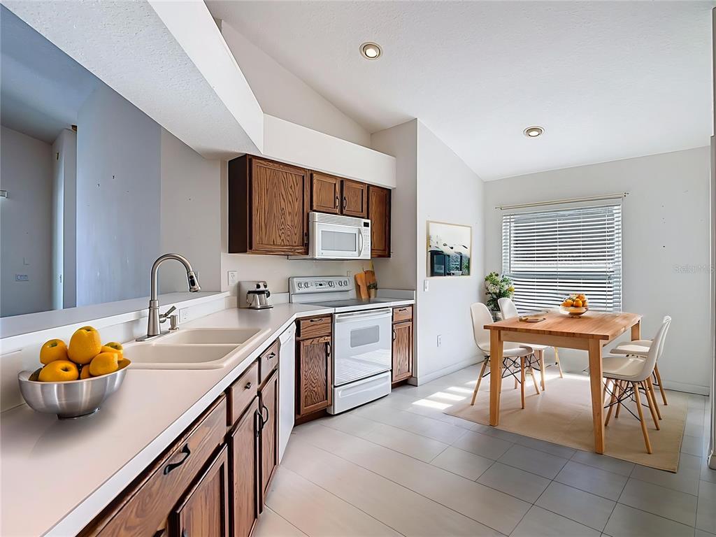 4824 Woodmere Road Land O Lakes, FL 34639 - Photo 6 of 50 a kitchen with cabinets a sink and appliances