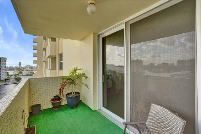 a view of a balcony with chairs