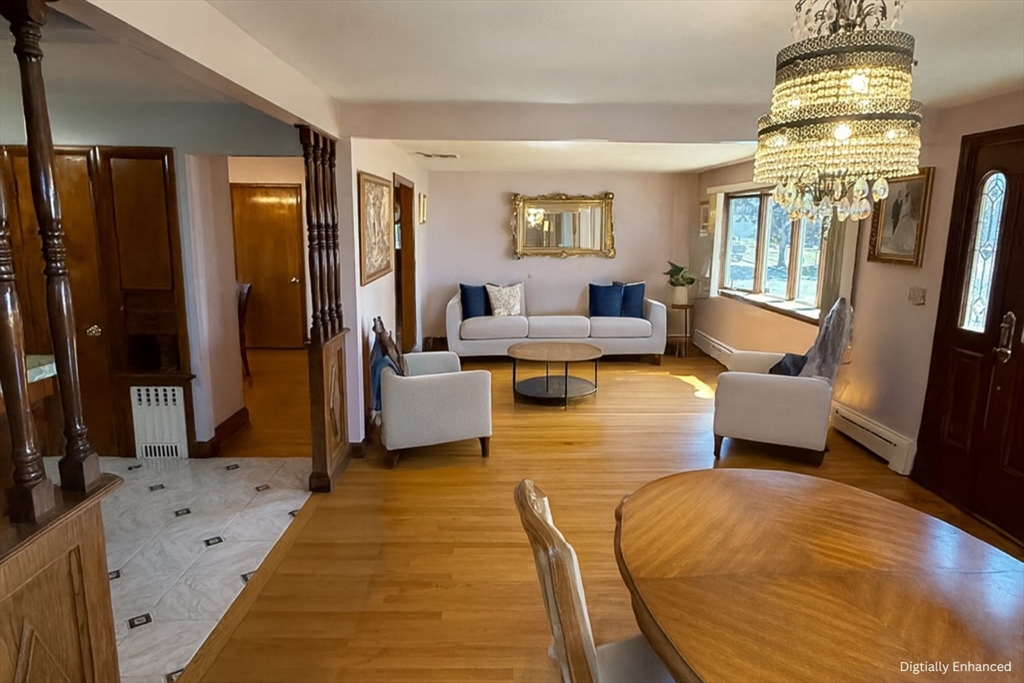 498 Tower Street Fall River, MA 02721 - Photo 2 of 8 a living room with furniture and a chandelier