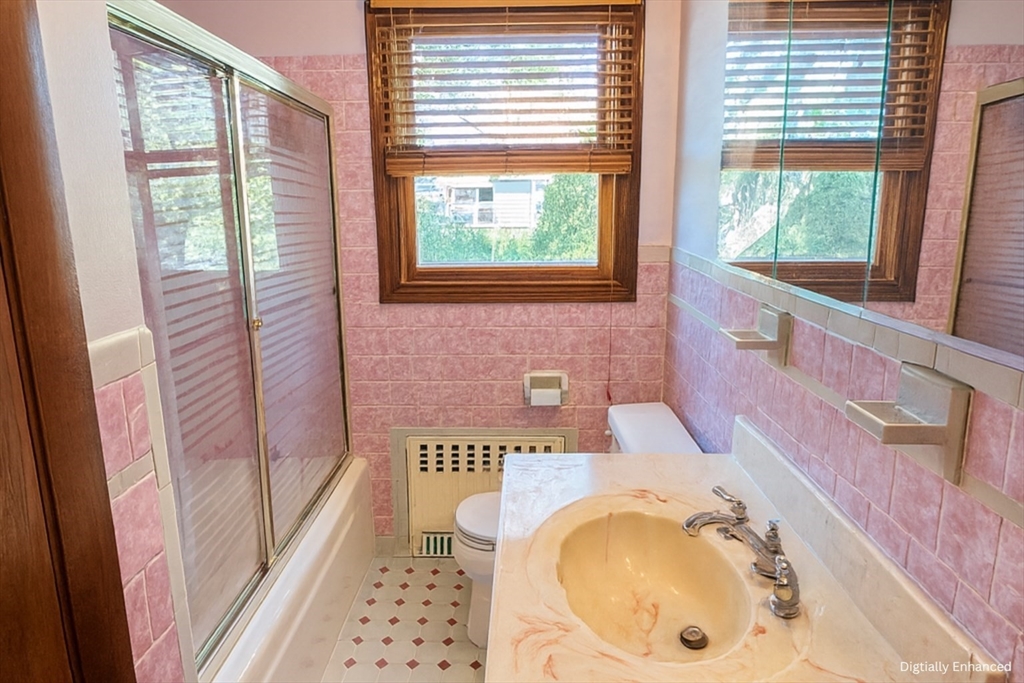 498 Tower Street Fall River, MA 02721 - Photo 5 of 8 a bathroom with a bathtub and a shower
