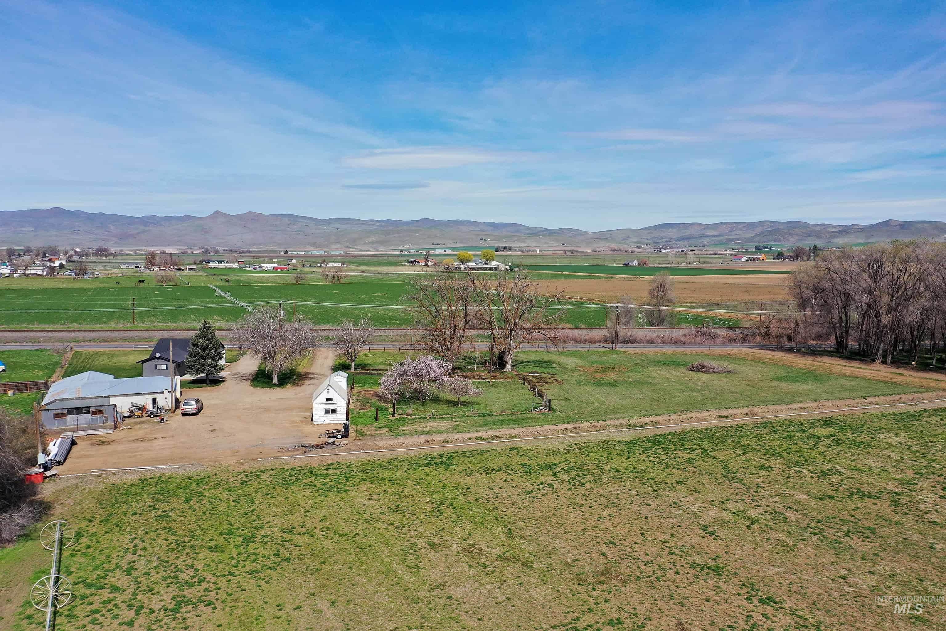 1009 County Road 70 Weiser, ID 83672 - Photo 43 of 48 Aerial view of sparsely populated area with a mountainous background