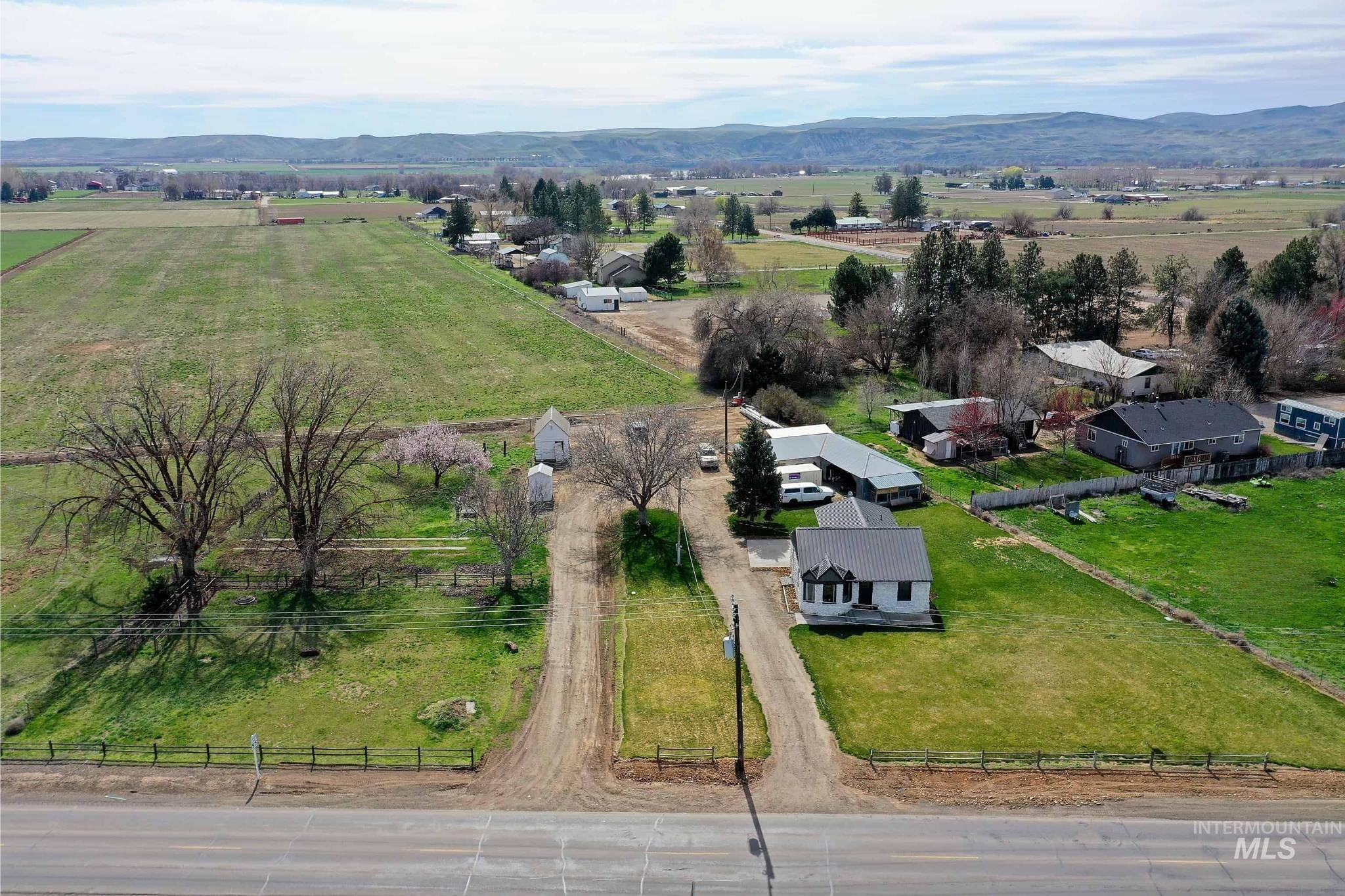 1009 County Road 70 Weiser, ID 83672 - Photo 44 of 48 Aerial view of sparsely populated area featuring a mountain backdrop