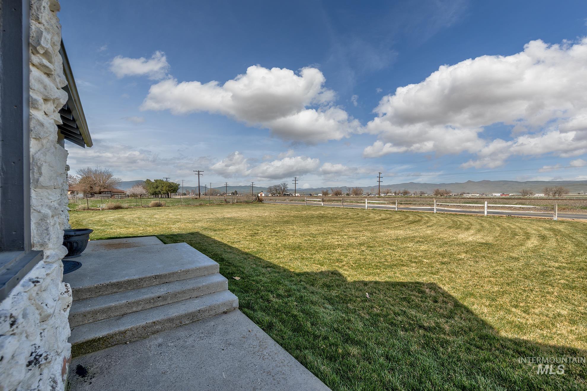 1009 County Road 70 Weiser, ID 83672 - Photo 5 of 48 Fenced backyard with a rural view