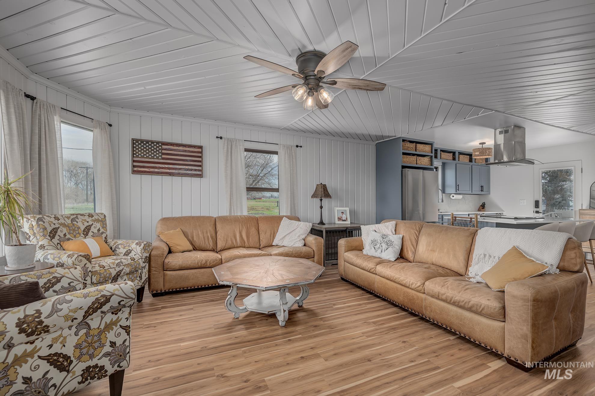 1009 County Road 70 Weiser, ID 83672 - Photo 6 of 48 Living area with a ceiling fan and light wood-type flooring