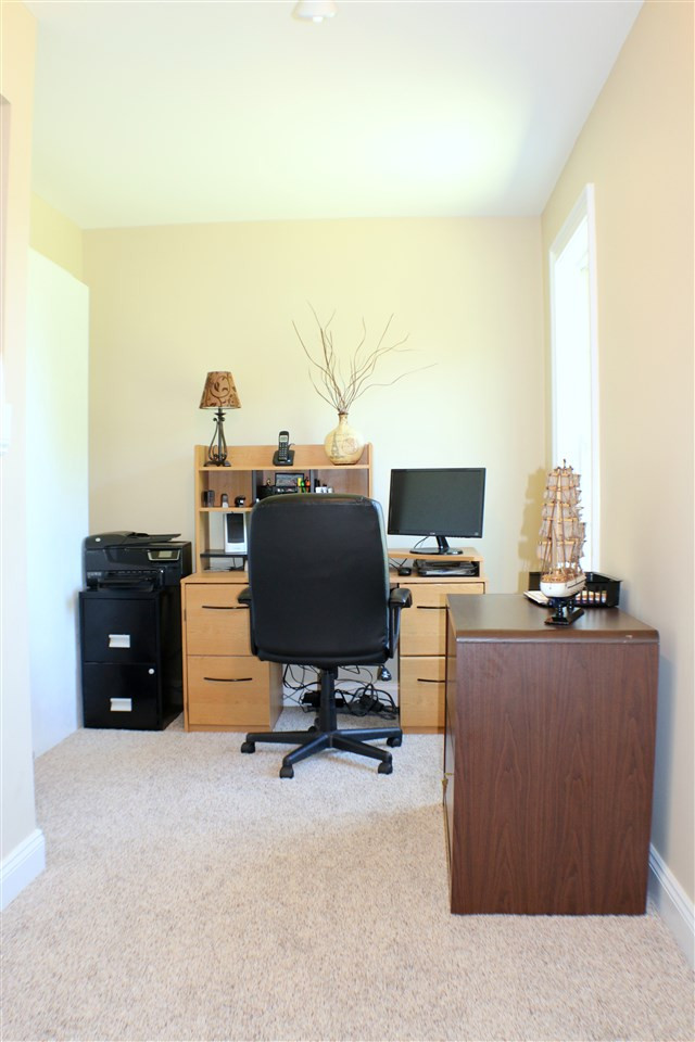 820 Hood Farm Road Clayton, NC 27520 - Photo 16 of 20 A hidden door in a bookshelf from the loft leads you into this bright, large Office or Study. Office / Study