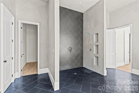 a view of entryway with wooden floor and windows