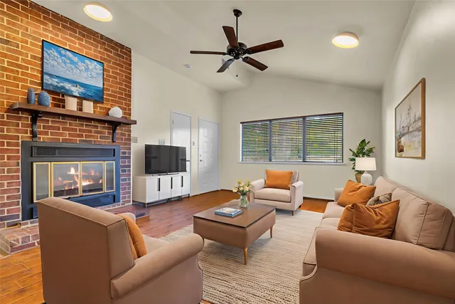 a living room with furniture and a fireplace