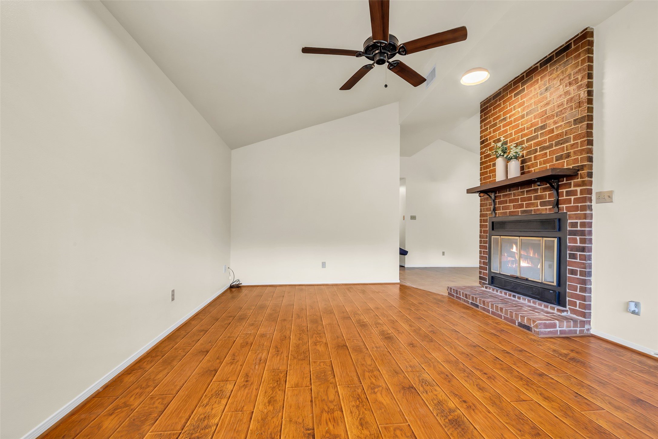 17831 West Fm 1097 Montgomery, TX 77356 - Photo 17 of 28 a view of empty room with wooden floor and fan