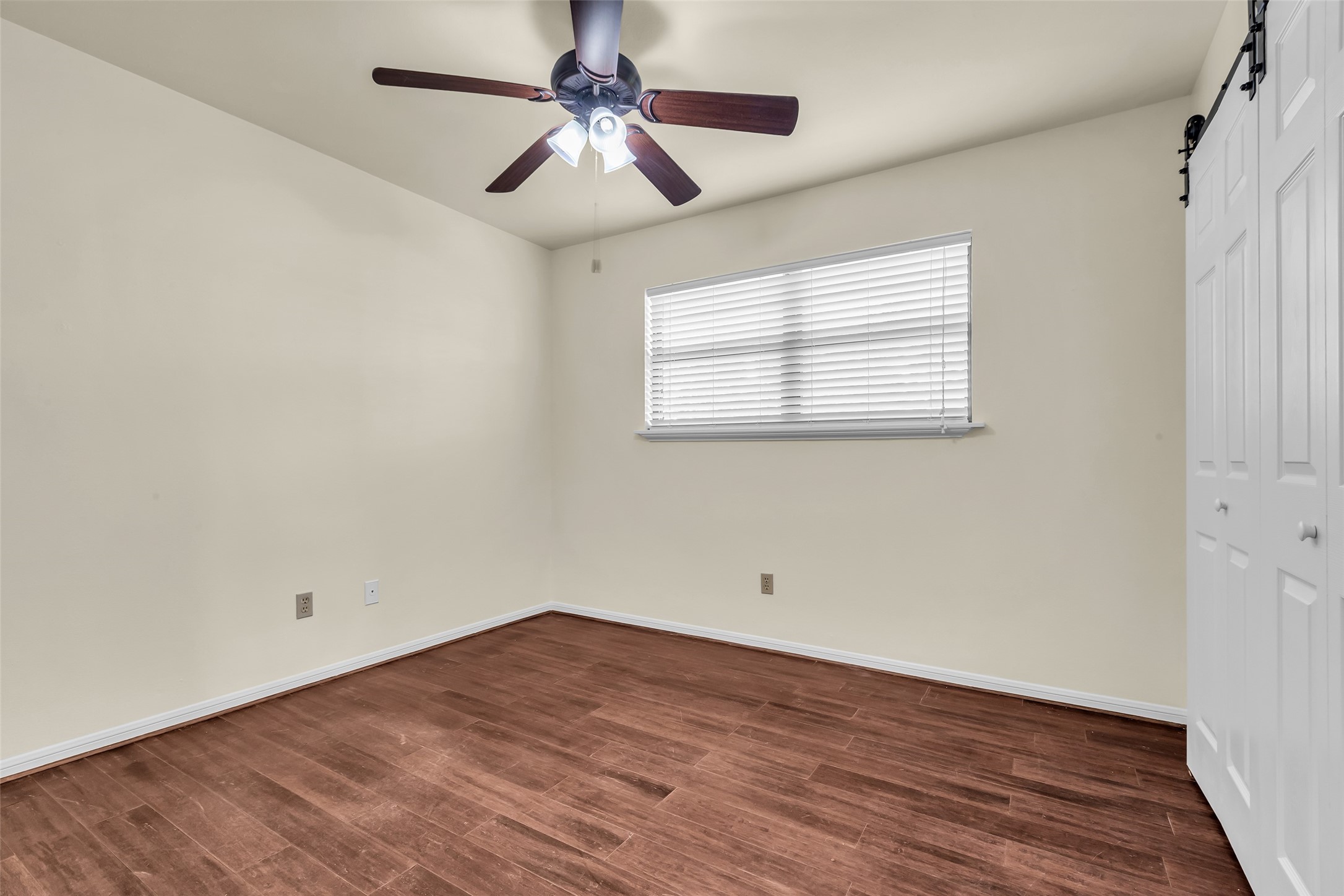 17831 West Fm 1097 Montgomery, TX 77356 - Photo 20 of 28 wooden floor in an empty room with a window