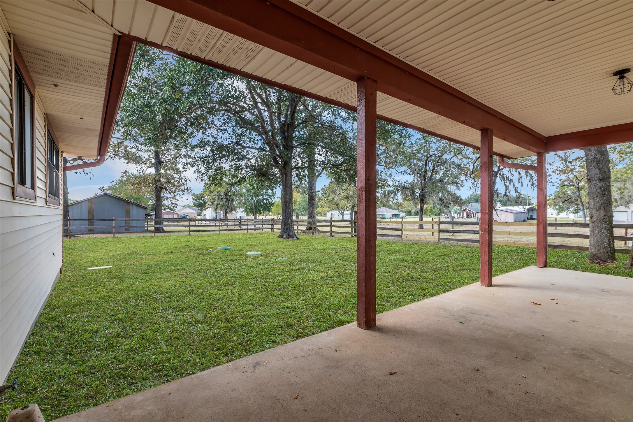17831 West Fm 1097 Montgomery, TX 77356 - Photo 23 of 28 a view of a house with a big yard potted plants and large tree