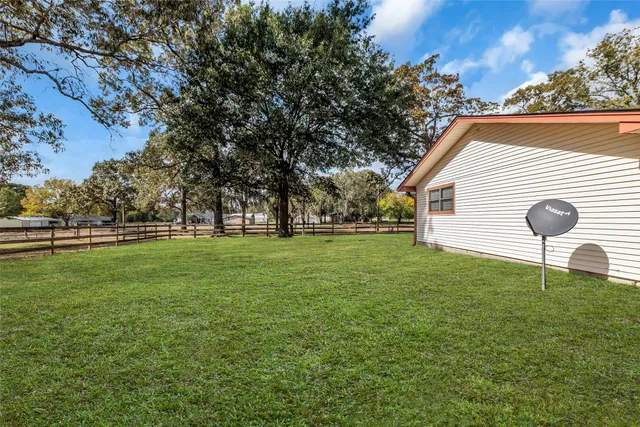 a backyard of a house with lots of green space