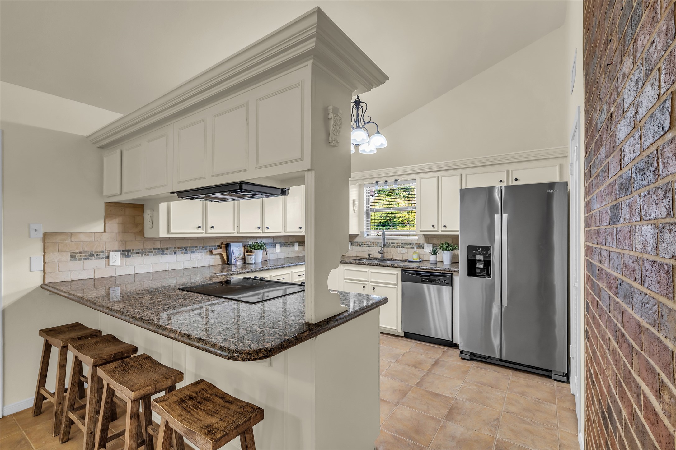 17831 West Fm 1097 Montgomery, TX 77356 - Photo 8 of 28 a kitchen with stainless steel appliances granite countertop a sink stove and refrigerator
