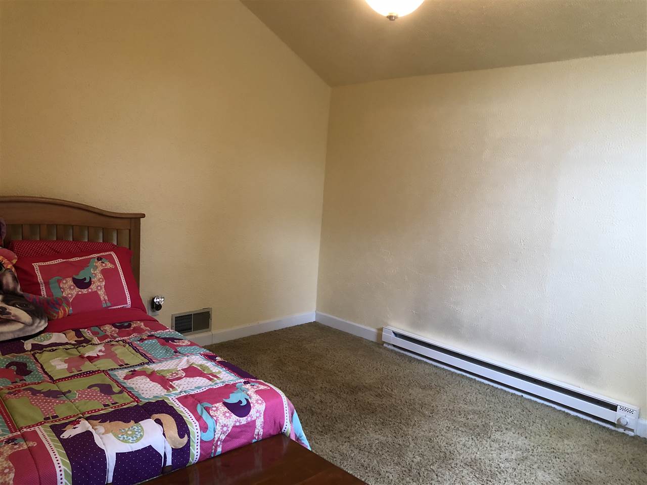 4502 Klinger Road Leaf River, IL 61047 - Photo 13 of 25 a bedroom with a bed and painting on the wall