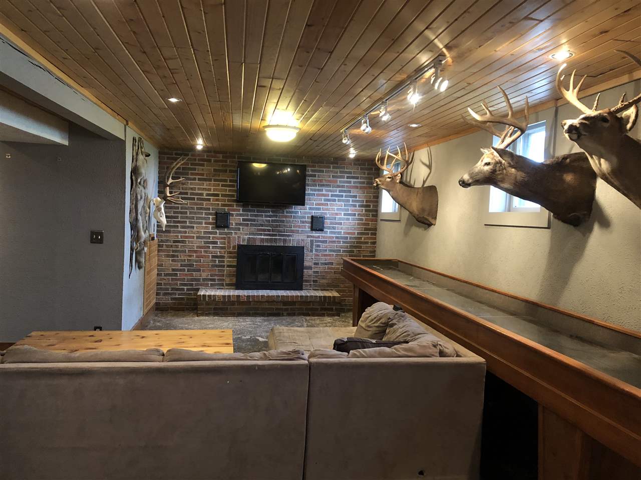 4502 Klinger Road Leaf River, IL 61047 - Photo 18 of 25 a living room with stainless steel appliances kitchen island a sink and a fireplace