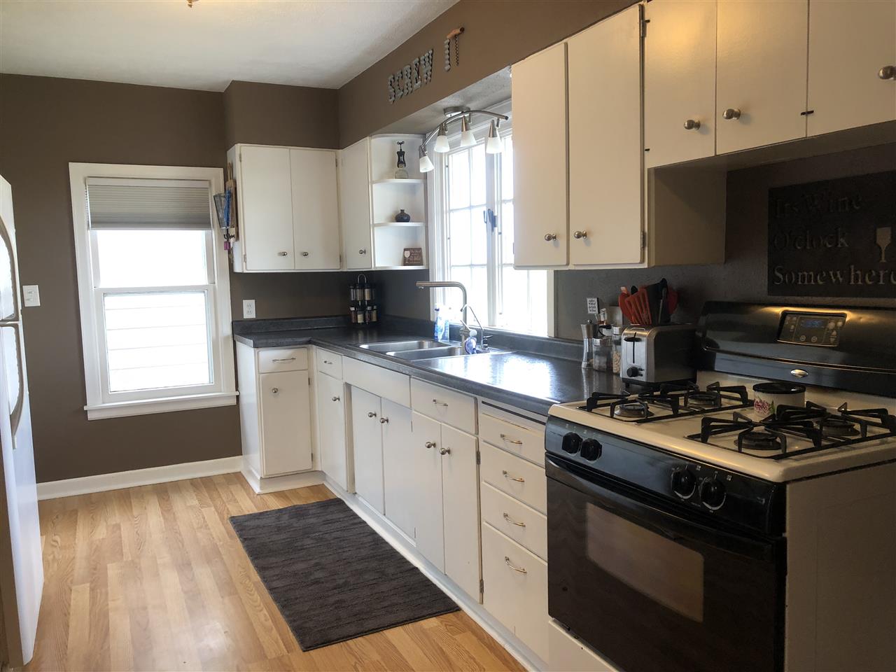 4502 Klinger Road Leaf River, IL 61047 - Photo 3 of 25 a kitchen with granite countertop a stove sink and cabinets