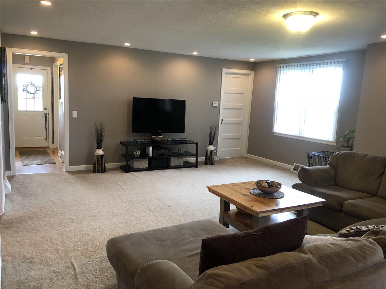 4502 Klinger Road Leaf River, IL 61047 - Photo 6 of 25 a living room with furniture and a flat screen tv