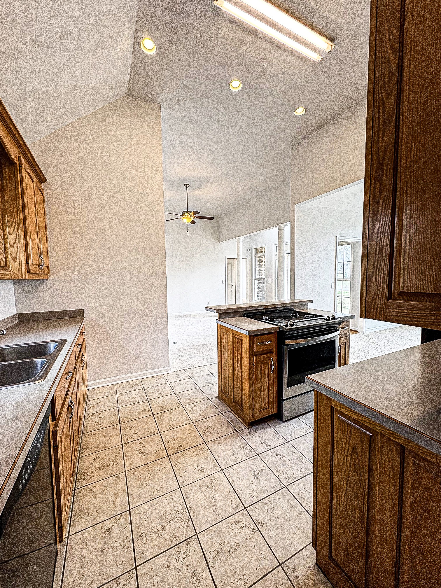 1508 Gray Fox Lane Spring Hill, TN 37174 - Photo 11 of 22 a kitchen with a stove a sink and a refrigerator