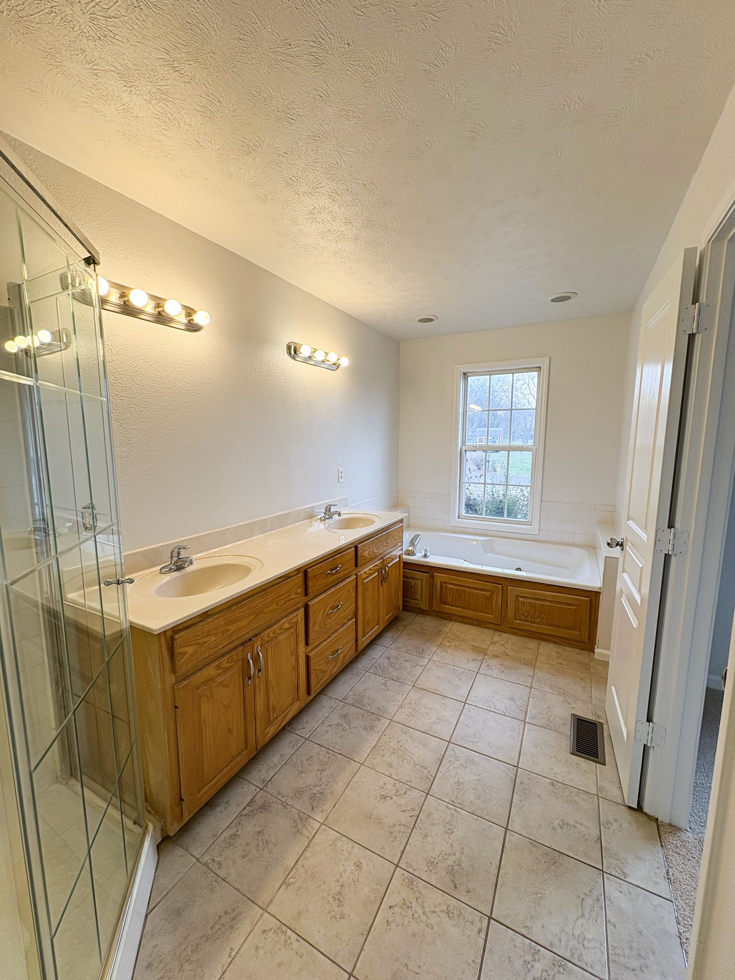 1508 Gray Fox Lane Spring Hill, TN 37174 - Photo 15 of 22 a bathroom with a tub sink and mirror