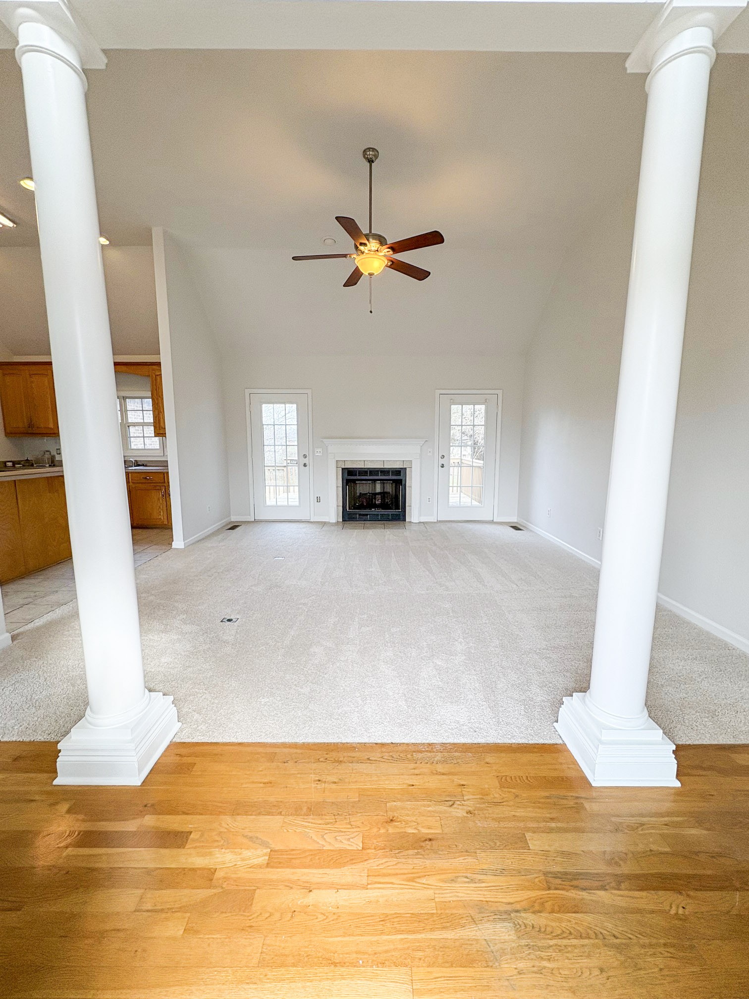 1508 Gray Fox Lane Spring Hill, TN 37174 - Photo 2 of 22 a view of a livingroom with a fireplace a ceiling fan and wooden floor