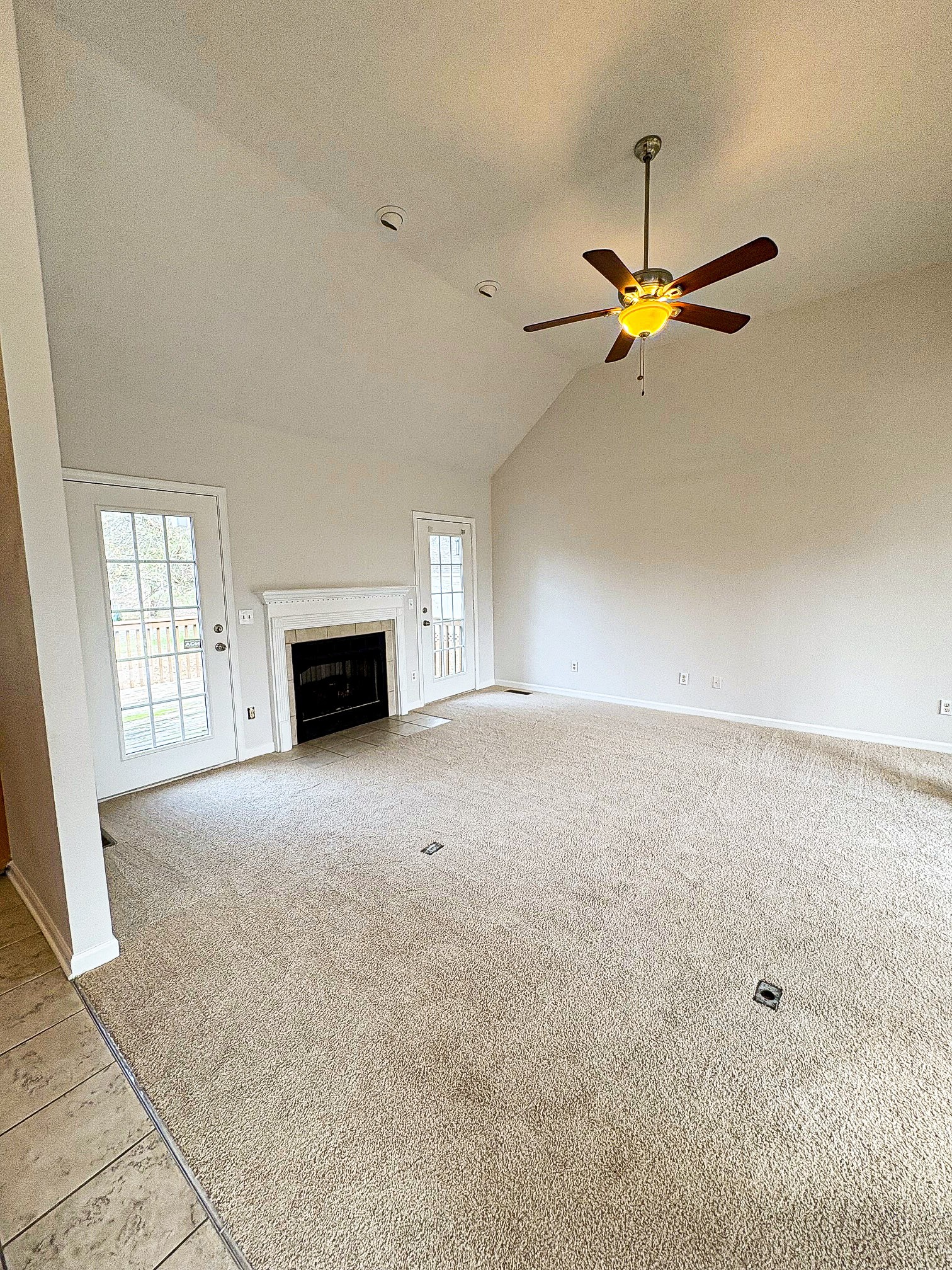 1508 Gray Fox Lane Spring Hill, TN 37174 - Photo 4 of 22 an empty room with windows and fireplace