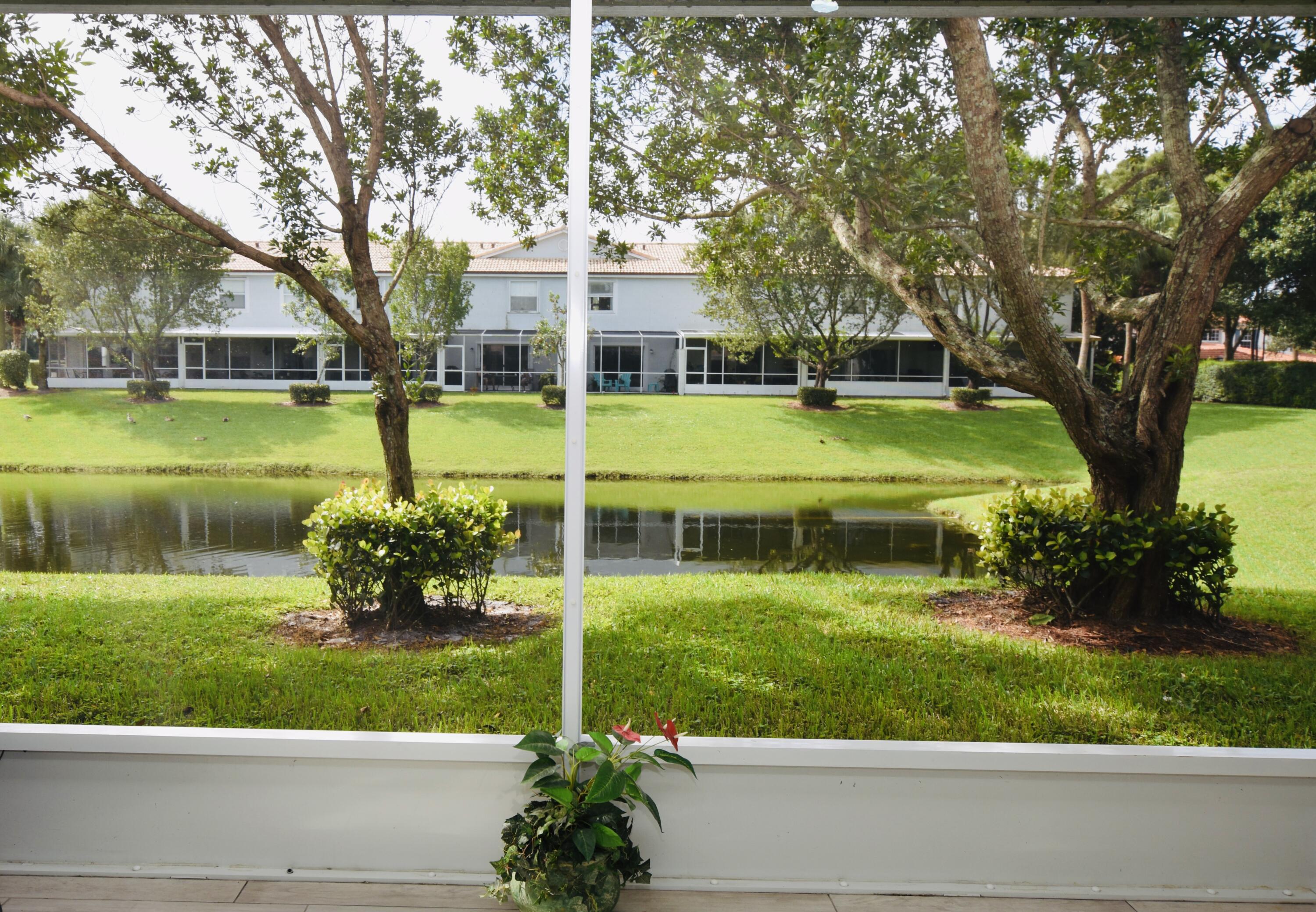 318 Timberwalk Trail Jupiter, FL 33458 - Photo 9 of 33 Back Patio w/ Lake View
