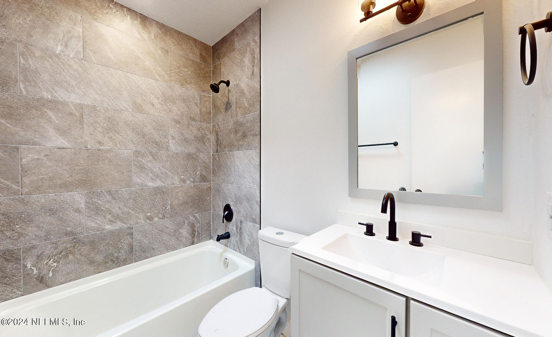 2136 Azore Court Jacksonville, FL 32216 - Photo 13 of 36 a bathroom with a sink a toilet and a bathtub