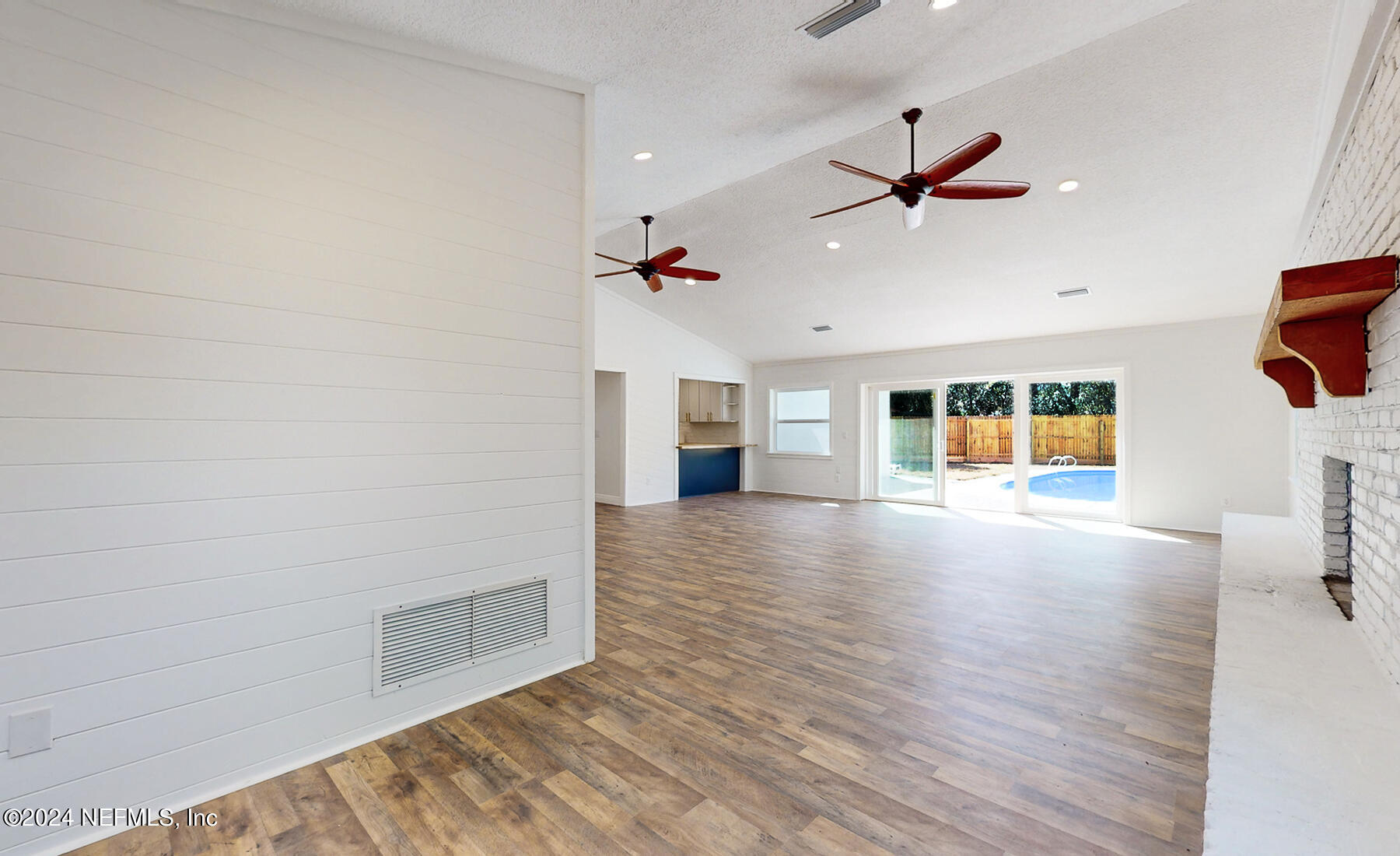 2136 Azore Court Jacksonville, FL 32216 - Photo 18 of 36 wooden floor in an empty room with a window