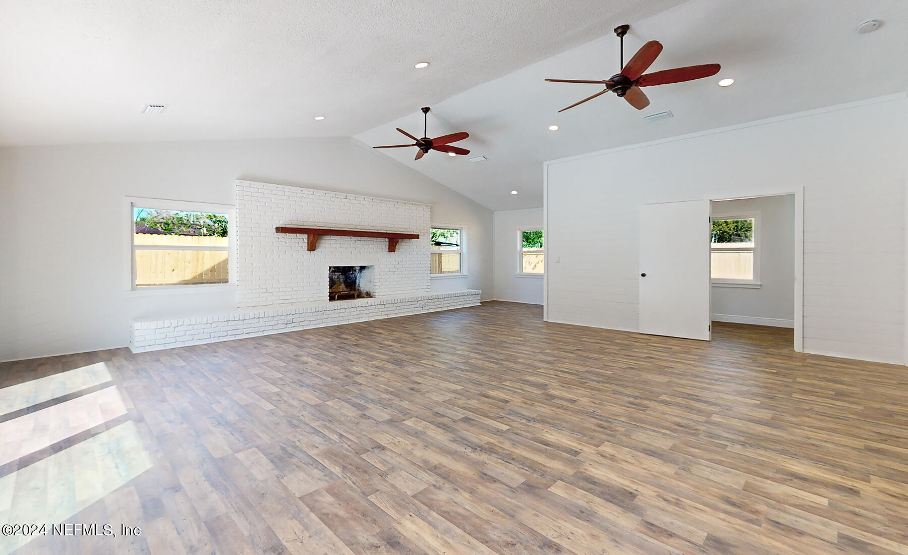 2136 Azore Court Jacksonville, FL 32216 - Photo 20 of 36 a view of empty room with wooden floor and ceiling fan