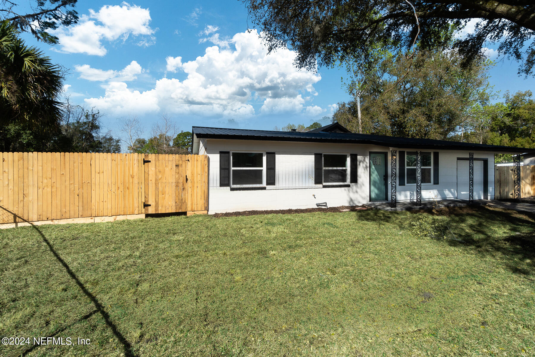 2136 Azore Court Jacksonville, FL 32216 - Photo 2 of 36 a view of a house with backyard and garden