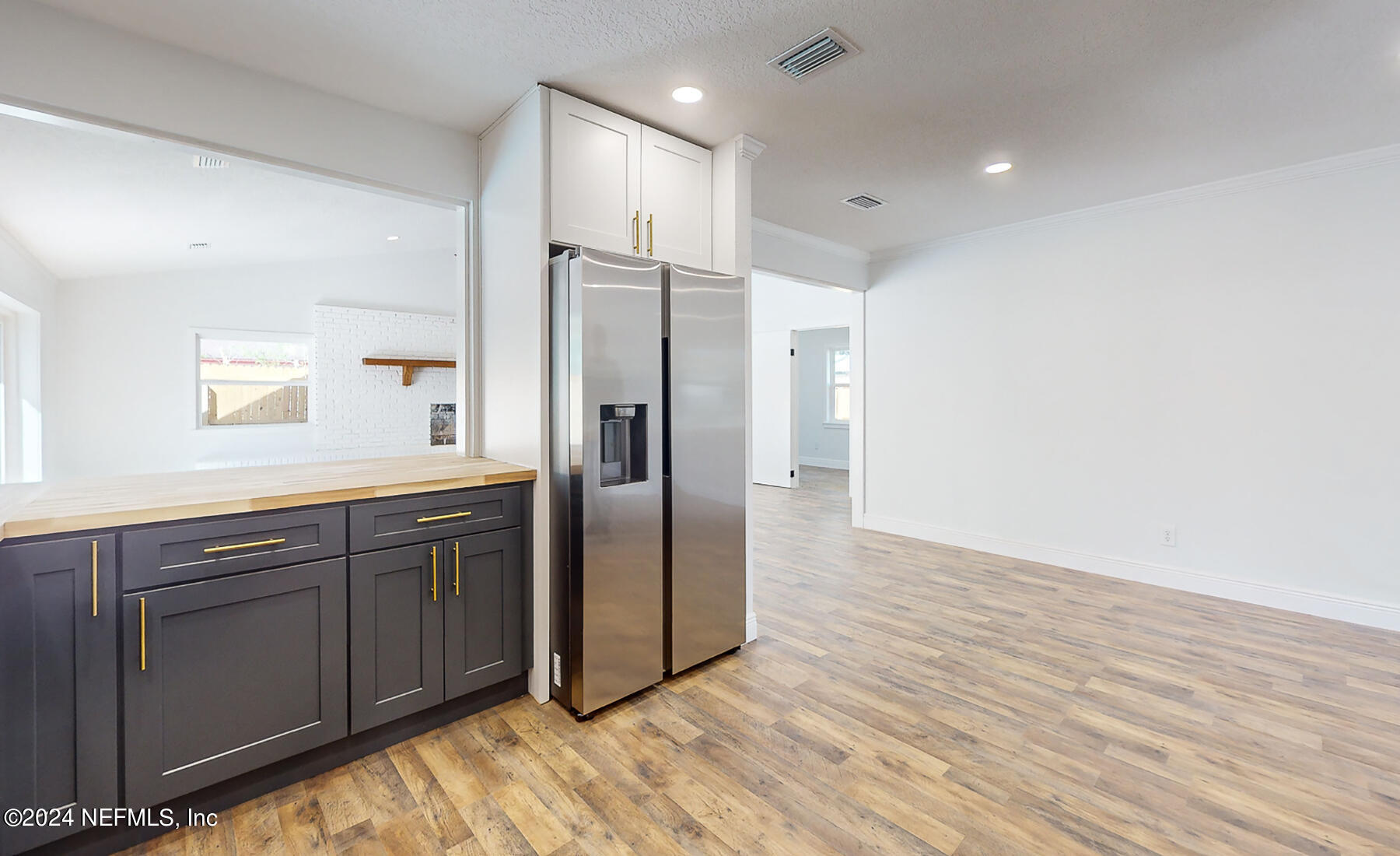 2136 Azore Court Jacksonville, FL 32216 - Photo 23 of 36 a kitchen with stainless steel appliances granite countertop a refrigerator and a sink