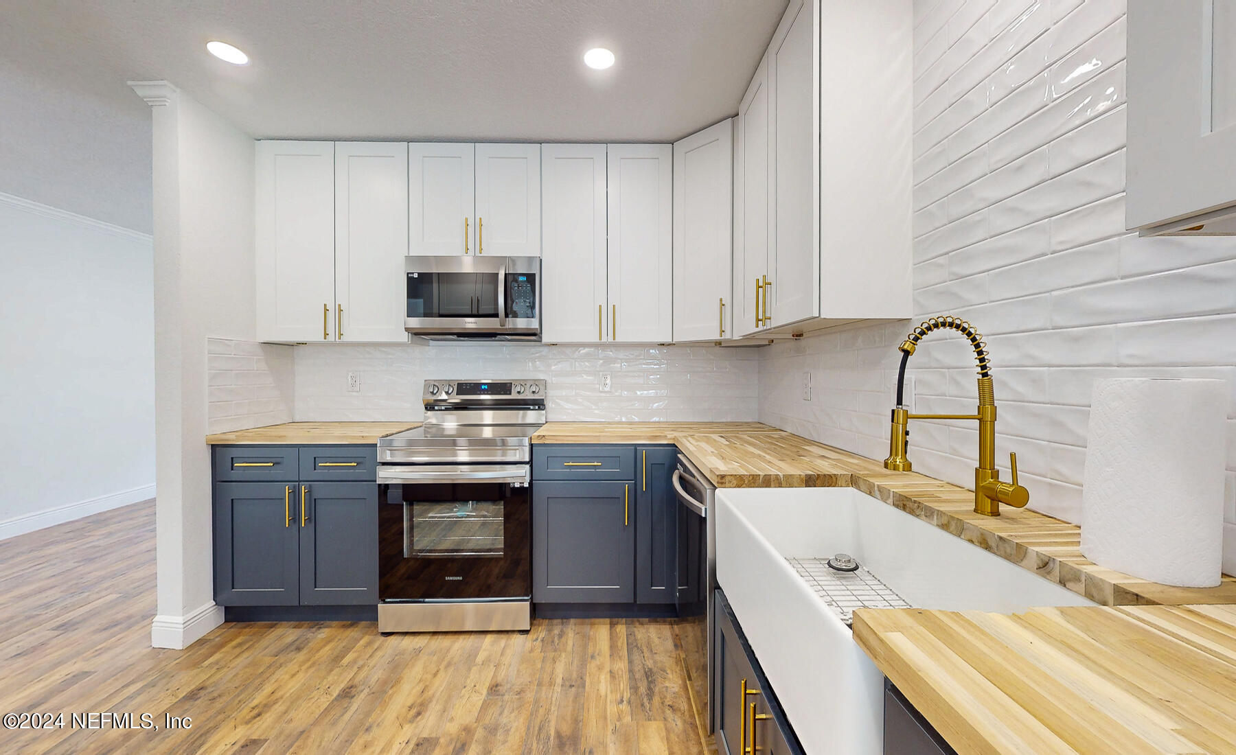 2136 Azore Court Jacksonville, FL 32216 - Photo 24 of 36 a kitchen with granite countertop a sink and a stove top oven