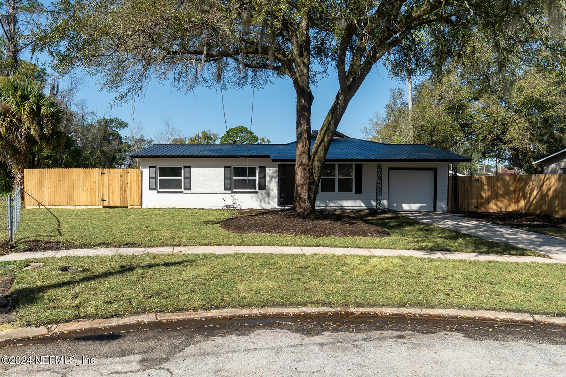 2136 Azore Court Jacksonville, FL 32216 - Photo 3 of 36 a front view of a house with a yard