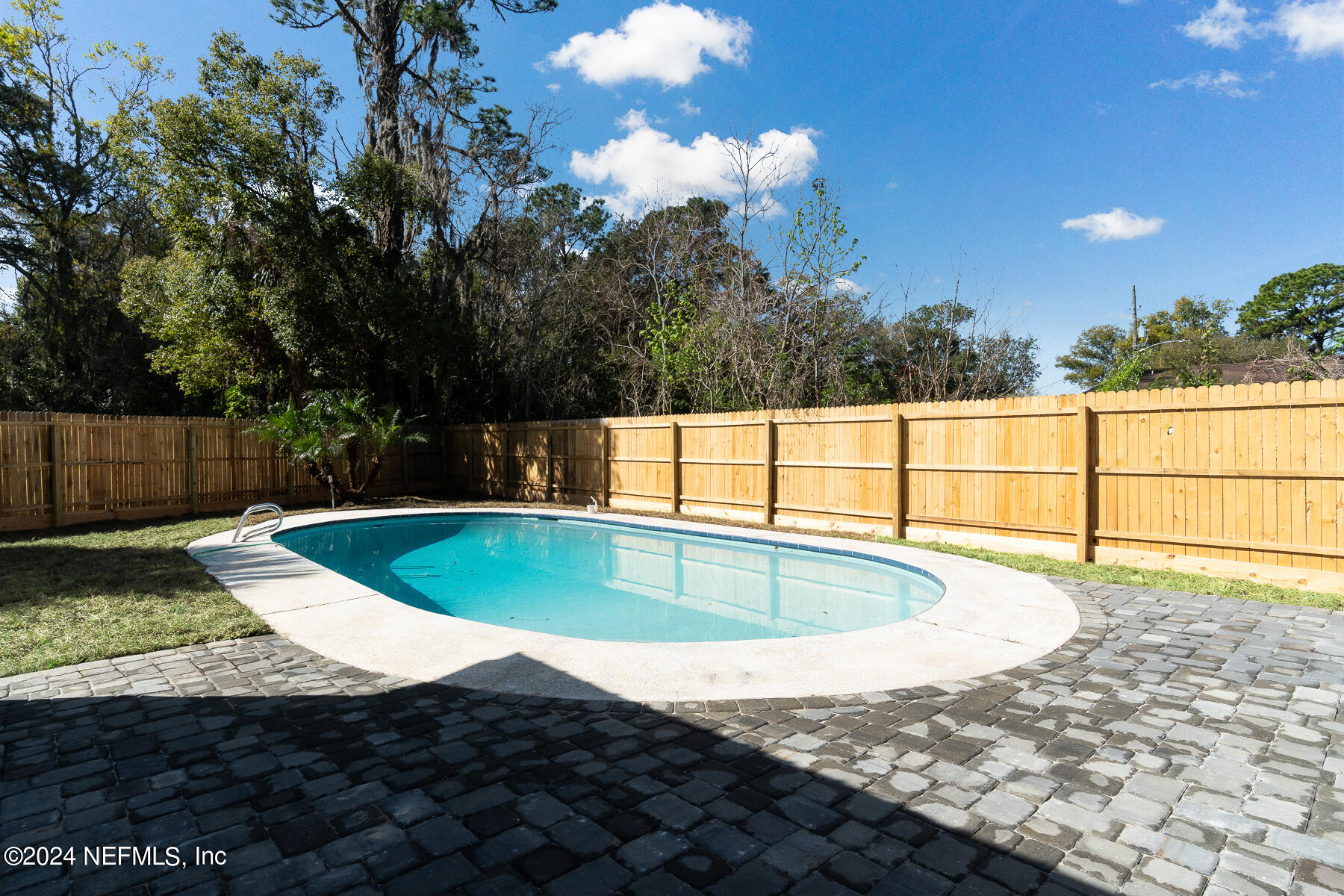 2136 Azore Court Jacksonville, FL 32216 - Photo 33 of 36 a view of a swimming pool with a yard