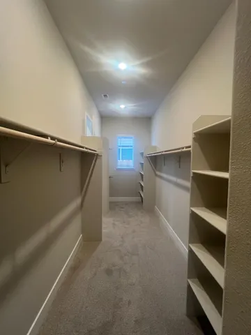 a view of an empty walk in closet