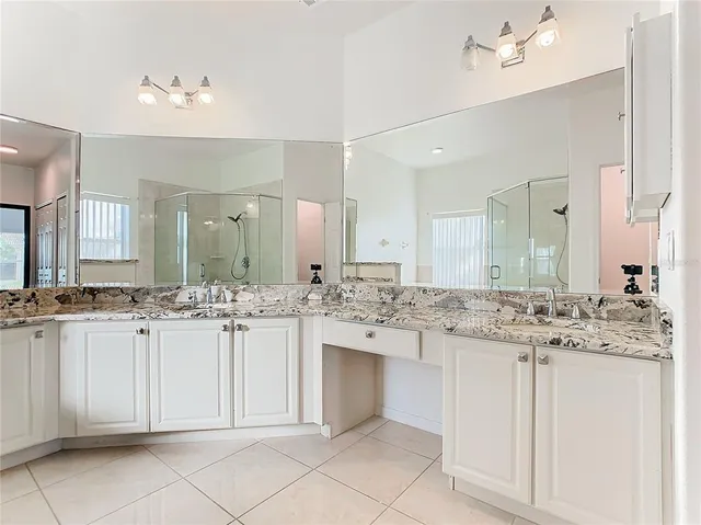a view of a house with porch and garden