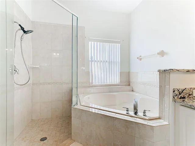 a aerial view of a house with a garden and lake view